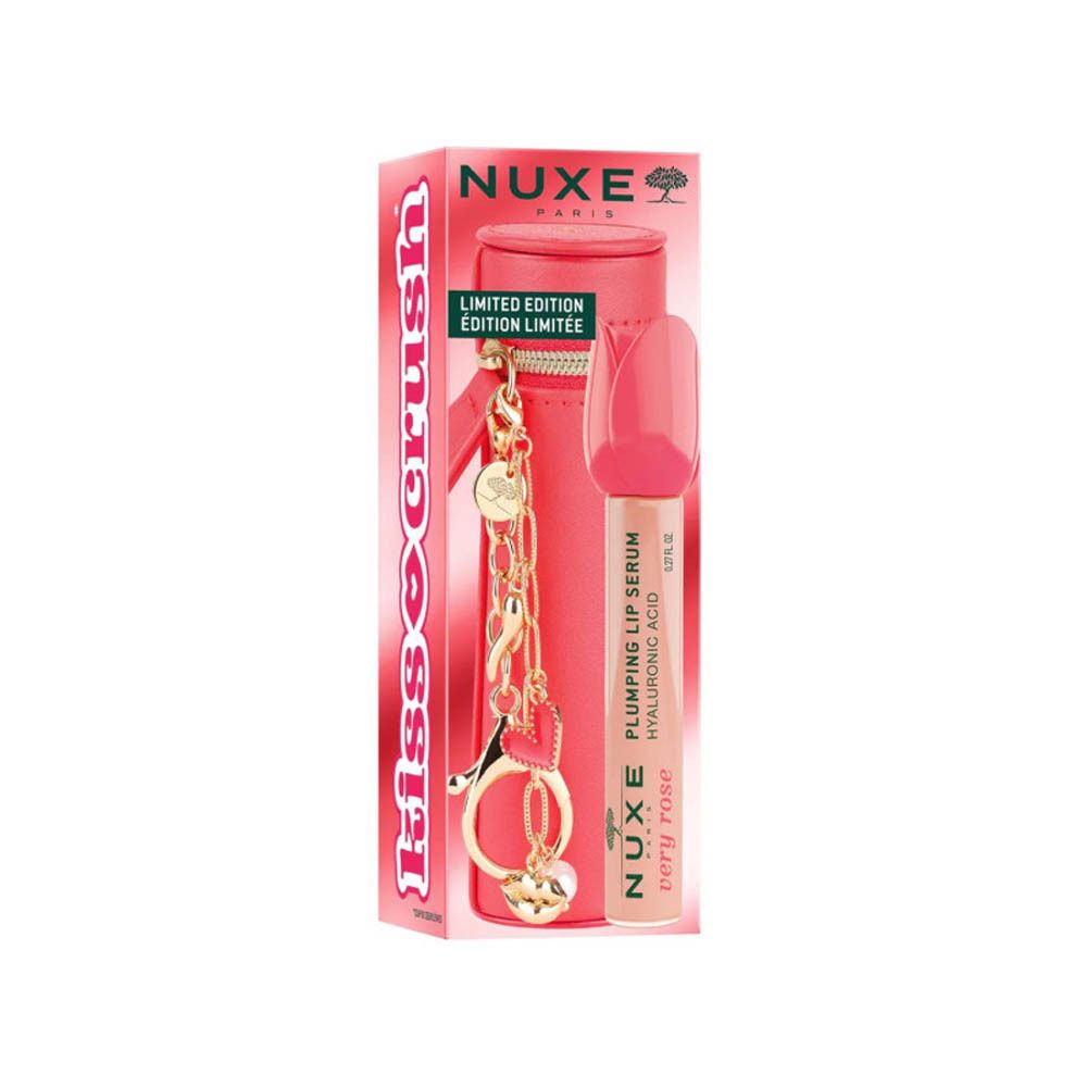 Boîte rouge avec inscription Kiss Crush. Sérum lèvres NUXE Very Rose avec étui. Breloques dorées.