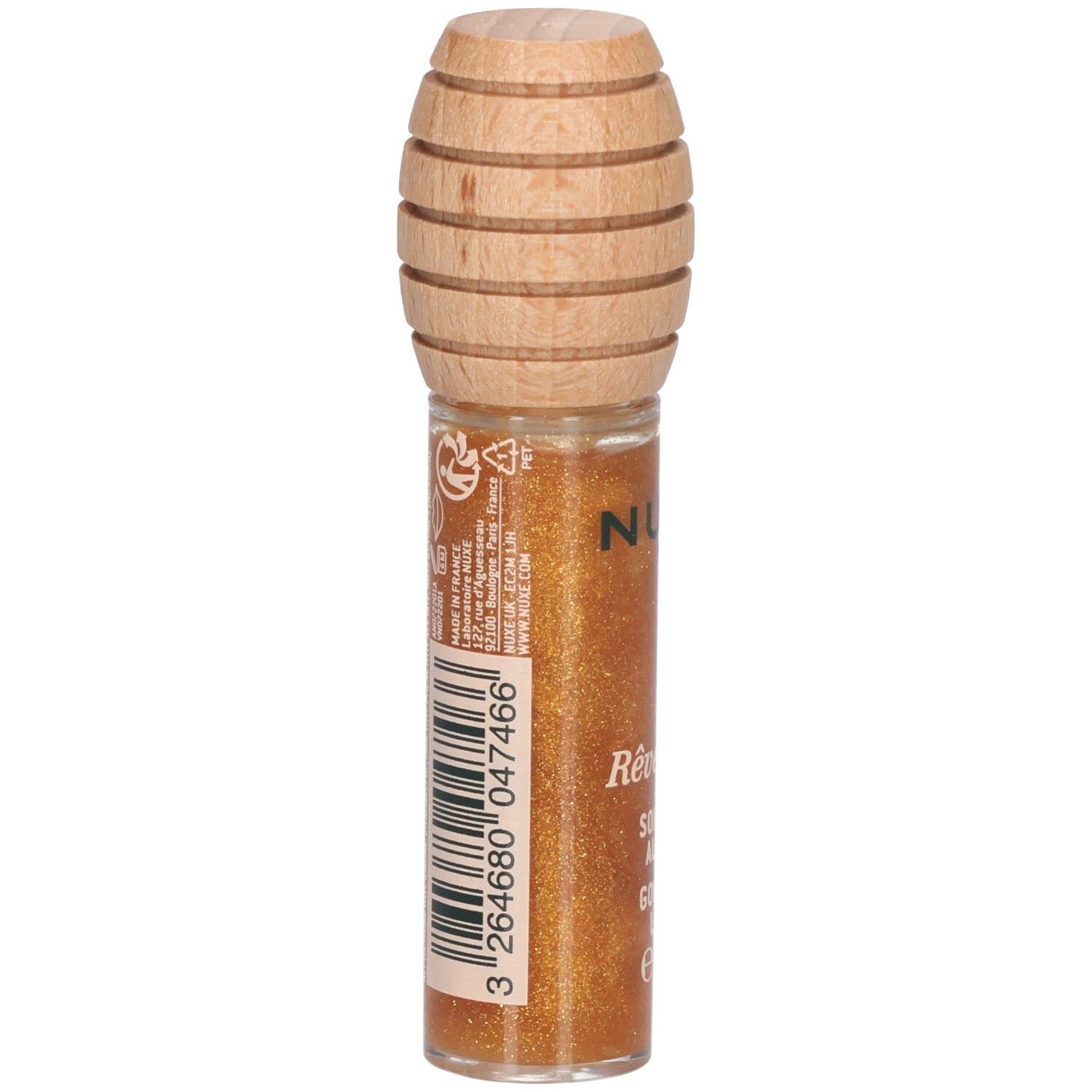 Goldfarbener Lipgloss in Glasflasche mit Holzverschluss. Auf der Rückseite Barcode und Text. Produktname: Rêve de miel, Soin Lèvres au Miel Or.