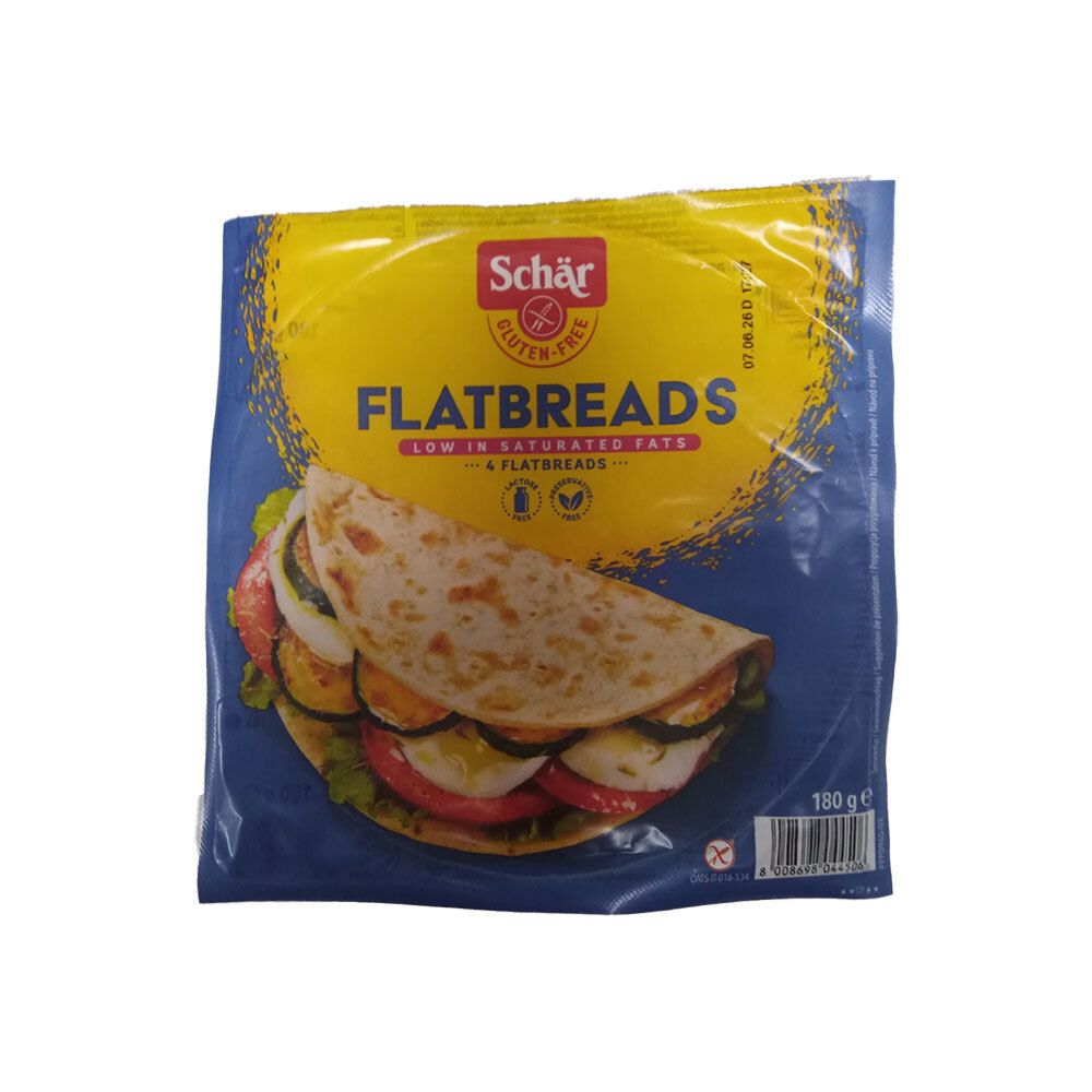 Verpackung mit Schär Flatbreads. Glutenfrei. Gezeigt ist ein gefülltes Flatbread. Blaue und gelbe Verpackung.