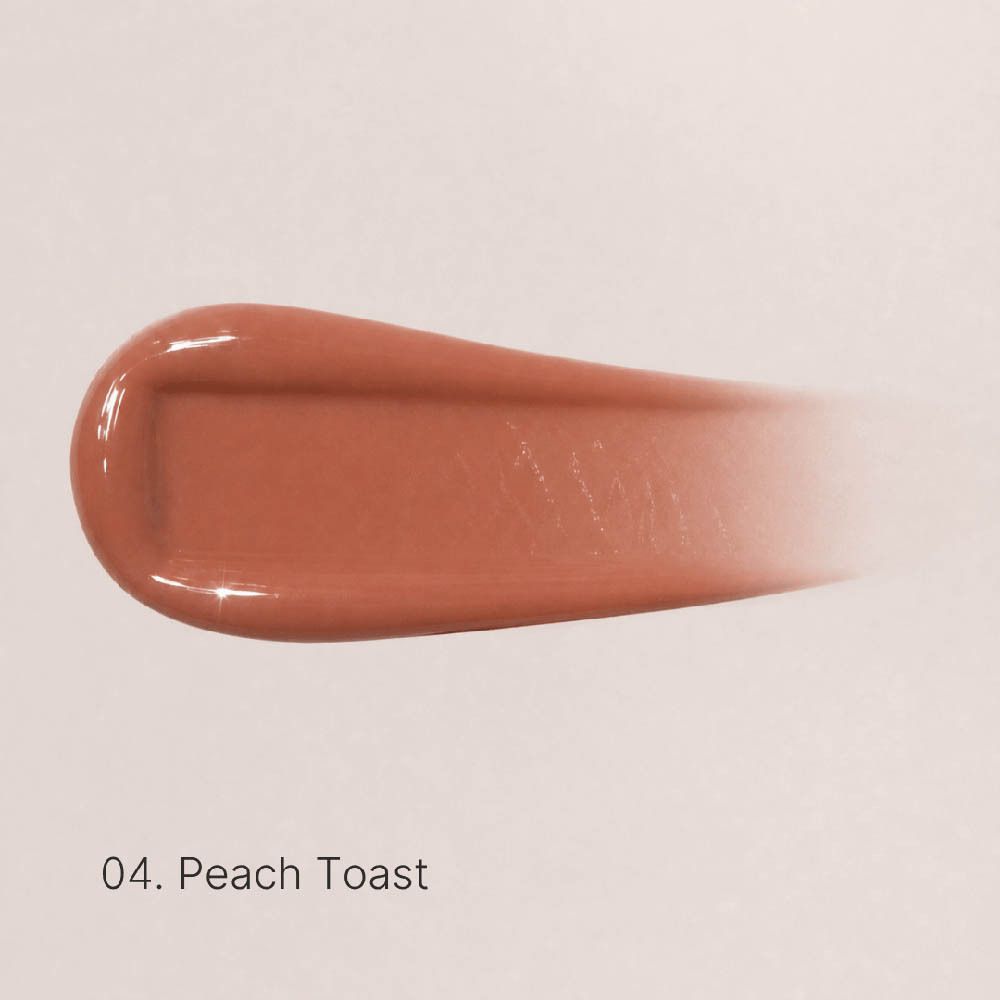 Ein Pfirsich-farbener Lippenstift-Swatch mit glänzendem Finish.