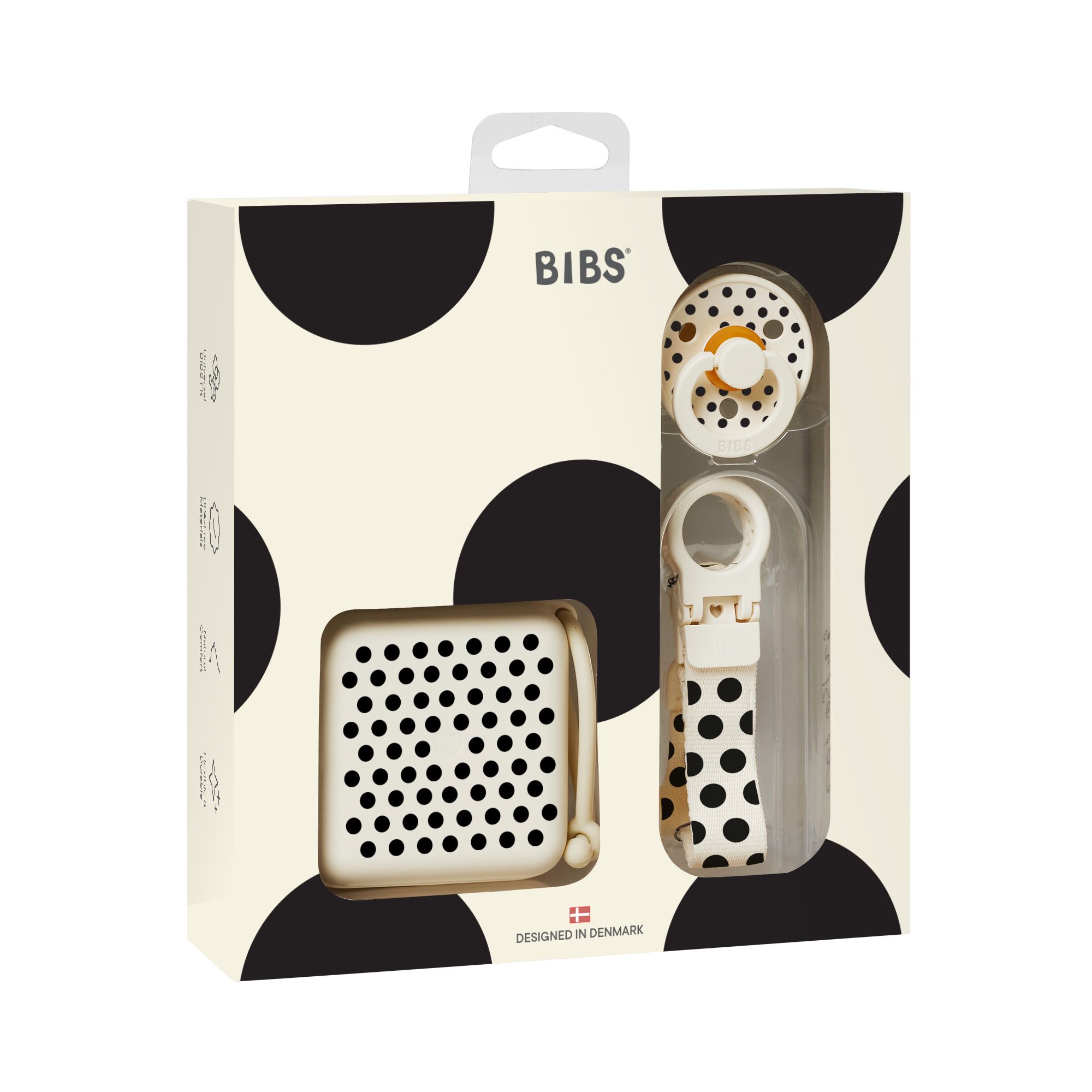 Coffret cadeau avec sucette, boîte et attache-sucette. Emballage à pois noirs. Marque BIBS.