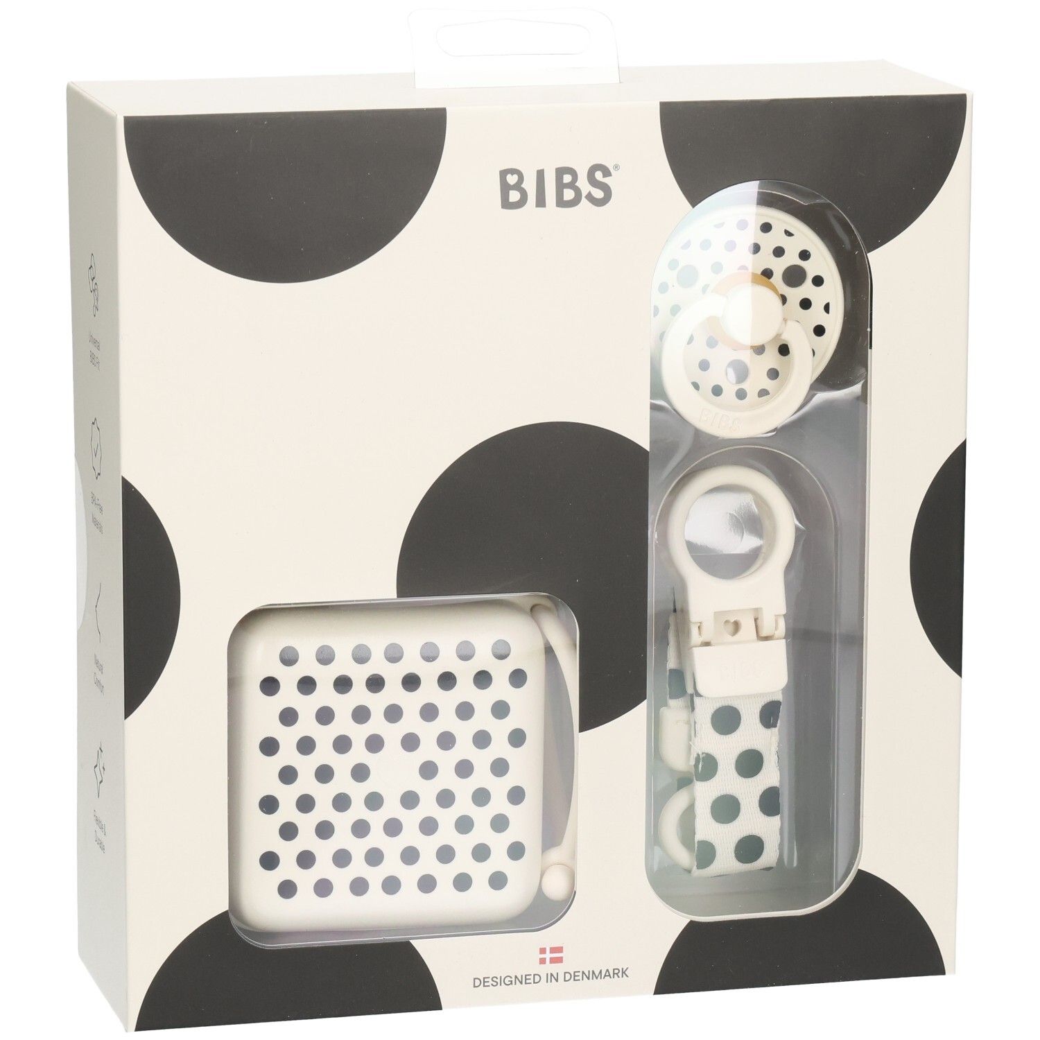 Geschenkset mit Schnuller, Schnullerbox und Schnullerband. Verpackung mit schwarzen Punkten. Marke BIBS.