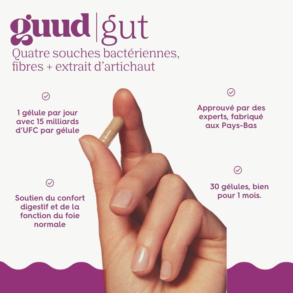 Main tenant une gélule. Texte : Guud Gut, 4 souches bactériennes, fibres + extrait d'artichaut. 1 gélule par jour, 30 gélules.