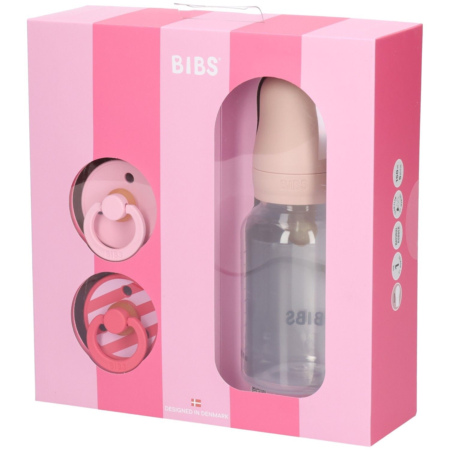 Rosa Geschenkbox mit Schnullern und Flasche. BIBS-Logo. Transparente Flasche mit Messskala. Zwei Schnuller.