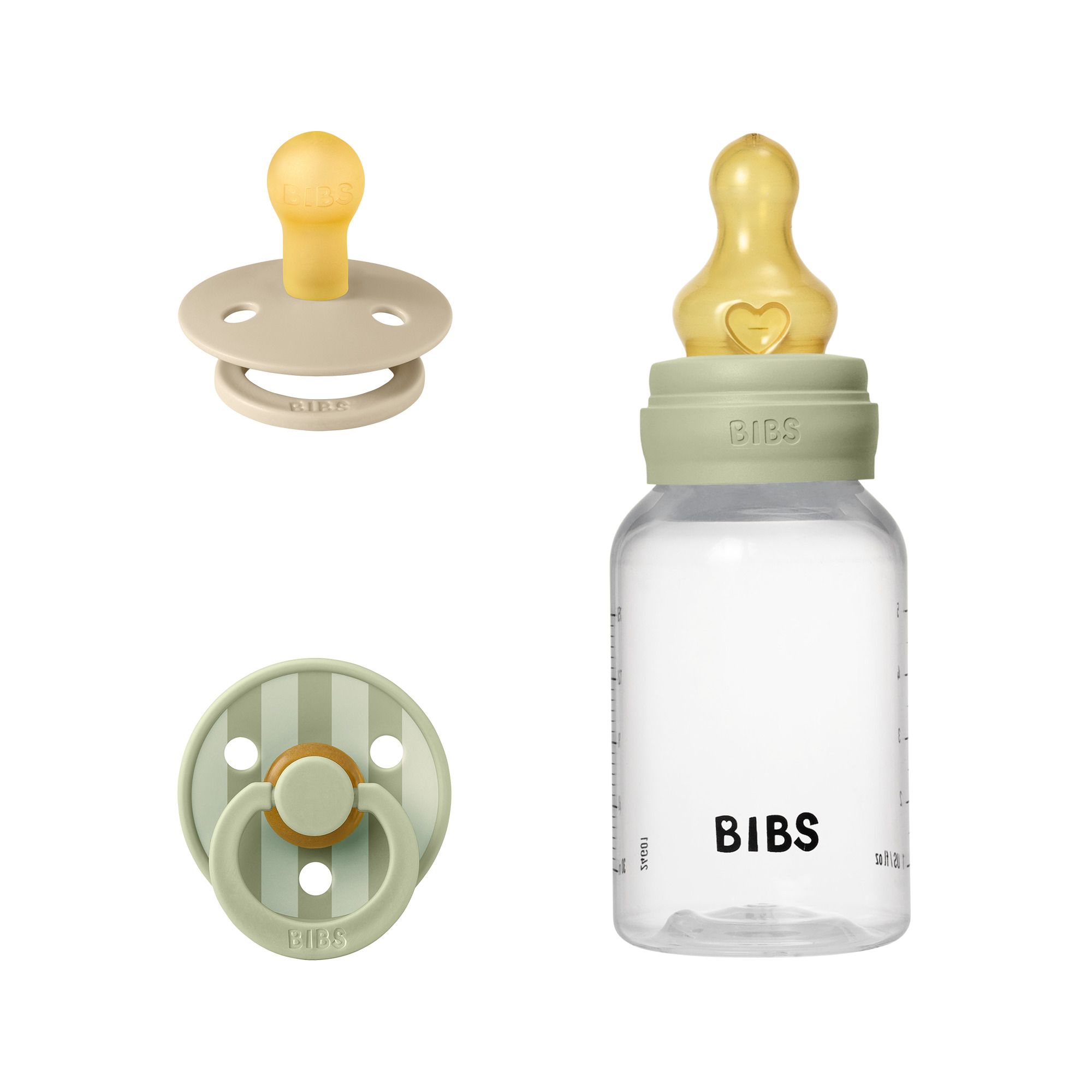 Trois produits : sucette, biberon et une autre sucette. Le nom de la marque est visible sur la bouteille.