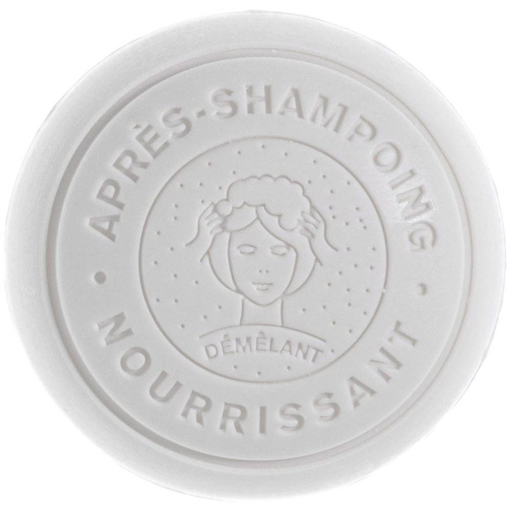 Runder weißer Deckel mit Prägung: "APRES-SHAMPOING NOURRISSANT DEMELANT" und Frauensymbol.