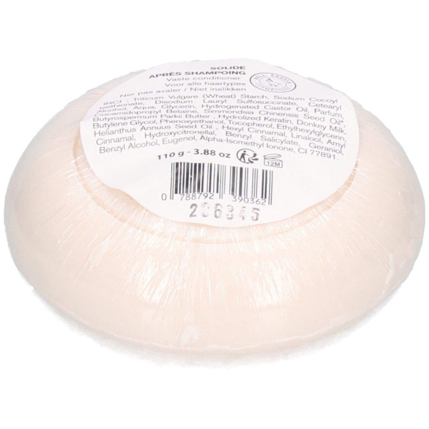 Fester Conditioner-Riegel, hellrosa, in Folie verpackt. Enthält Etikett mit Inhaltsstoffen und Barcode.