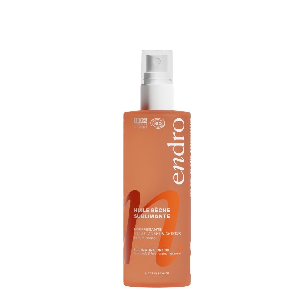 Flacon spray orange avec logo Endro et texte 'Huile Sèche Sublimante'.
