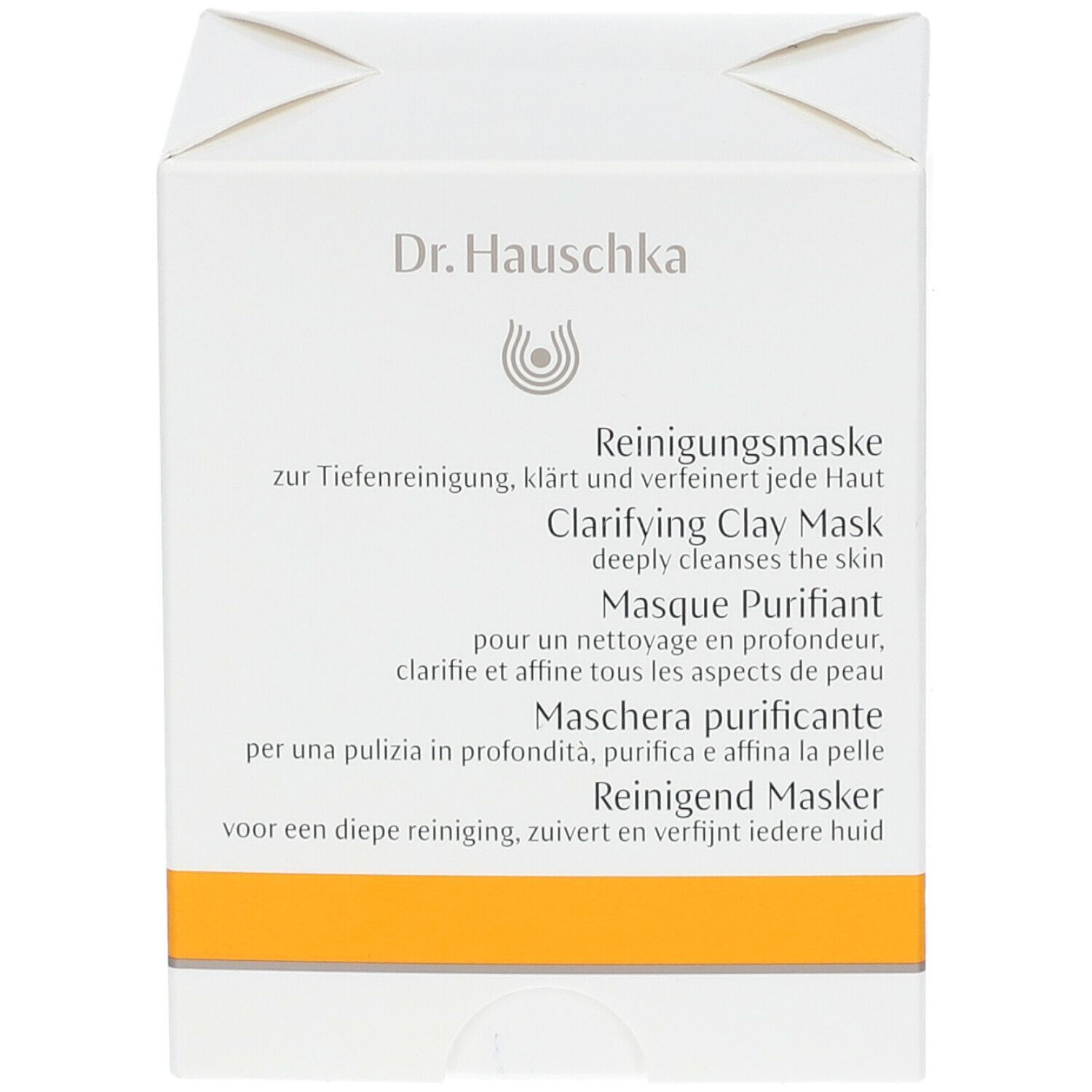 Weiße Kartonverpackung mit gelbem Streifen. Aufschrift: Dr. Hauschka, Reinigende Maske, Clarifying Clay Mask.