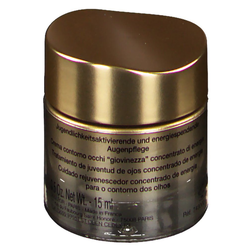 Pot doré avec couvercle. Inscription: Soin jeunesse yeux. 15 ml. Informations produit en plusieurs langues.