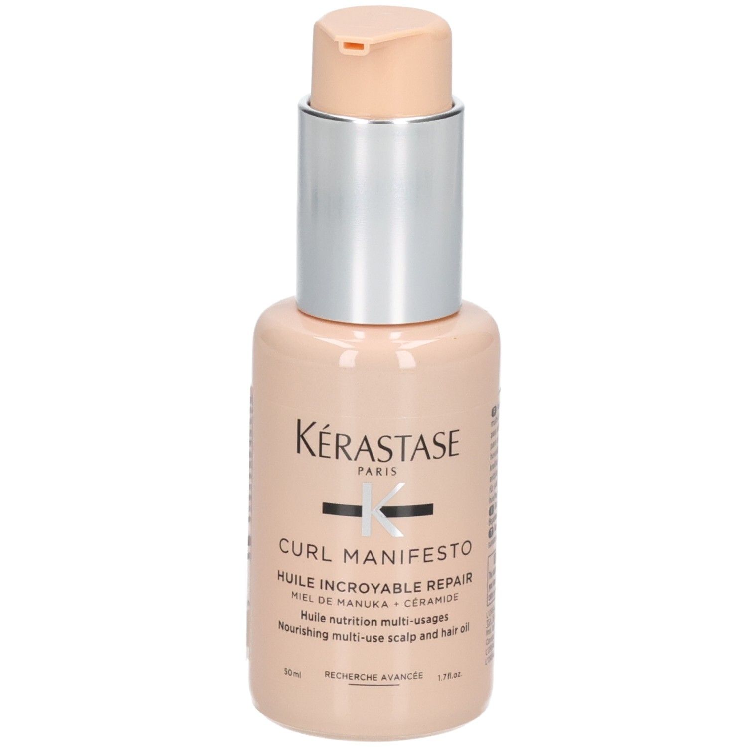 Kérastase Curl Manifesto Haarpflegeöl in einem pfirsichfarbenen Flakon mit Pumpspender. Enthält Manuka-Honig und Ceramid.