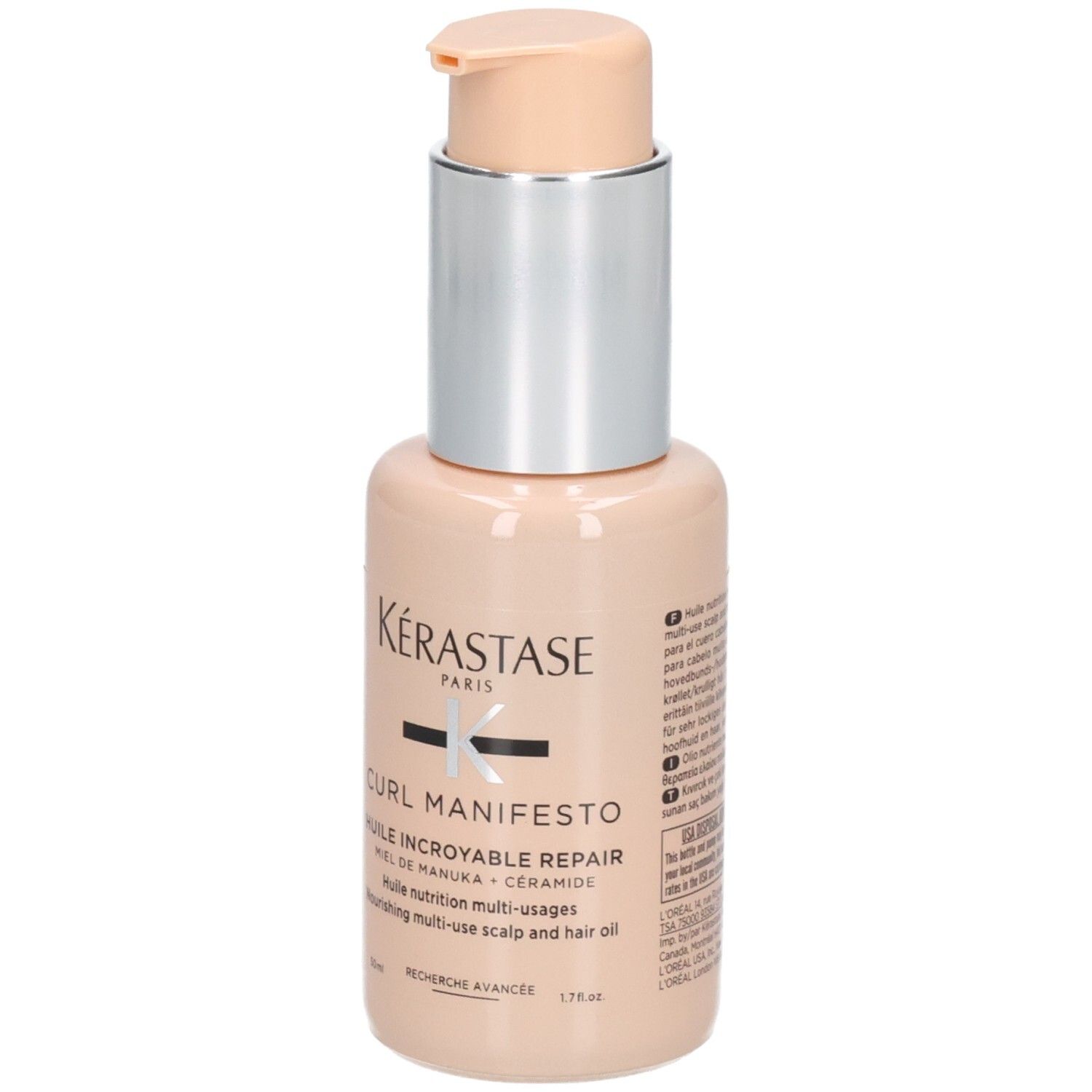 Kérastase Curl Manifesto Huile Incroyable Repair Flasche mit Pumpspender. Beigefarbene Flasche mit silbernem Hals und hellem Pumpspender.