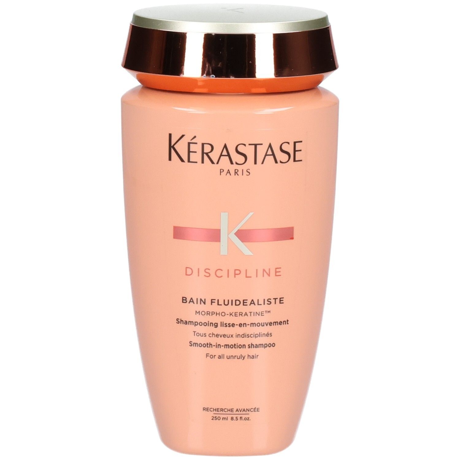 Kérastase Discipline Bain Fluidéaliste Shampoo, 250ml. Pfirsichfarbene Flasche mit silbernem und kupferfarbenem Deckel.