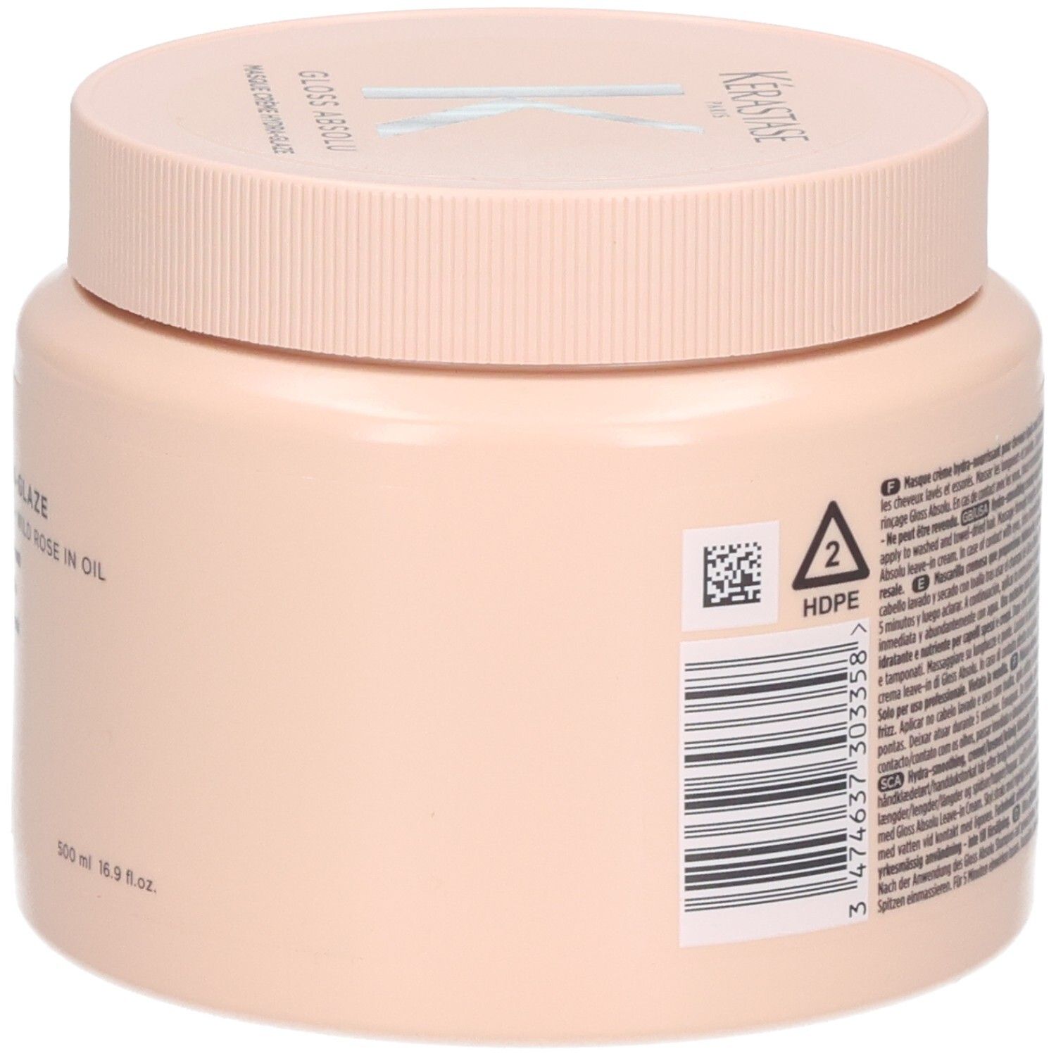 Ein pfirsichfarbener Tiegel mit einer Kappe, auf der "KERASTASE" steht. Enthält 500 ml.