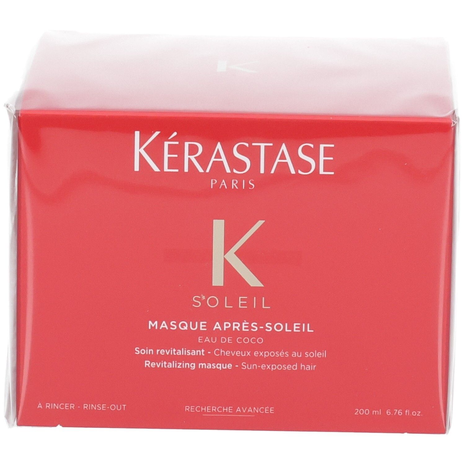 Face avant de l'emballage rouge Kérastase Soleil Après-Soleil avec nom du produit et indication de volume.