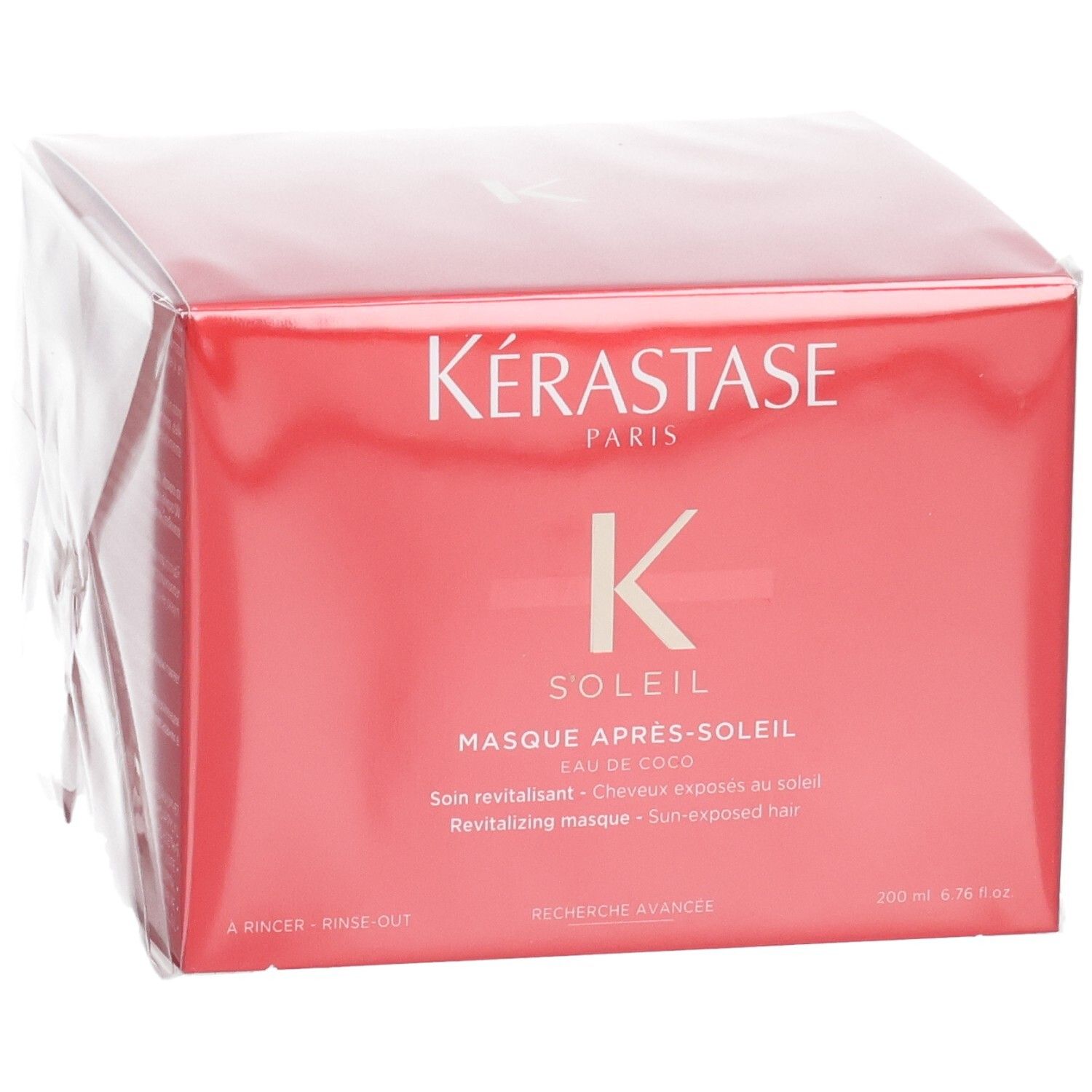 Masque Après-Soleil Kérastase Soleil revitalisant dans son emballage rouge, vu légèrement de face.