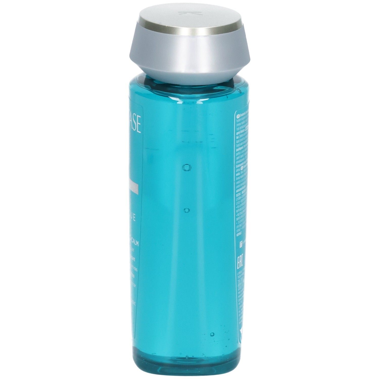 Kérastase Bain Vital Dermo-Calm Shampoo, Seitenansicht der blauen Flasche mit silbernem Verschluss.