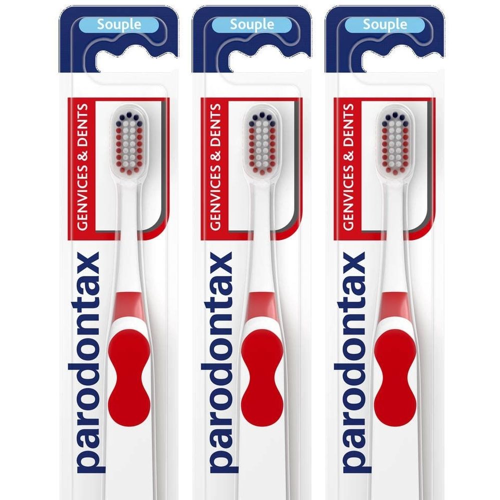 Trois brosses à dents emballées. Manche blanc avec insert rouge, tête rouge. Inscription: Paradontax. Emballage avec inscription: Souple.