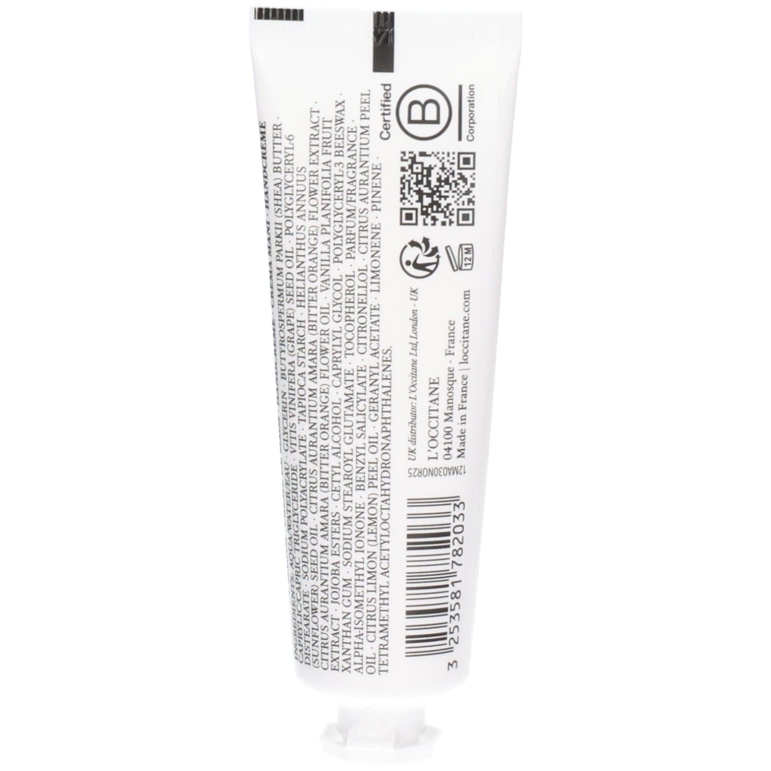 Rückseite einer weißen Tube mit Inhaltsstoffen und Zertifizierungen für L'Occitane Handcreme.