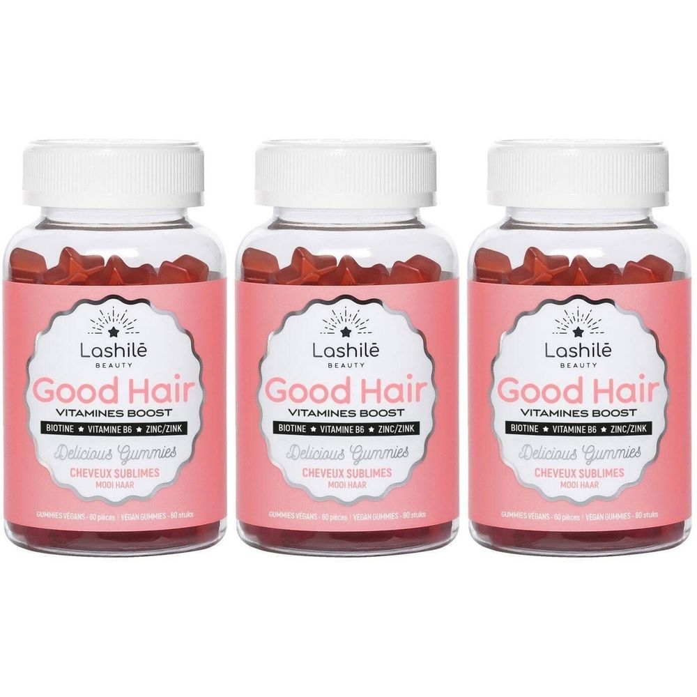 Trois flacons de Good Hair Lashilé Beauty. Étiquettes roses, bouchons blancs. Texte: Vitamines Boost, Biotine, Zinc, B6, Delicious Gummies.