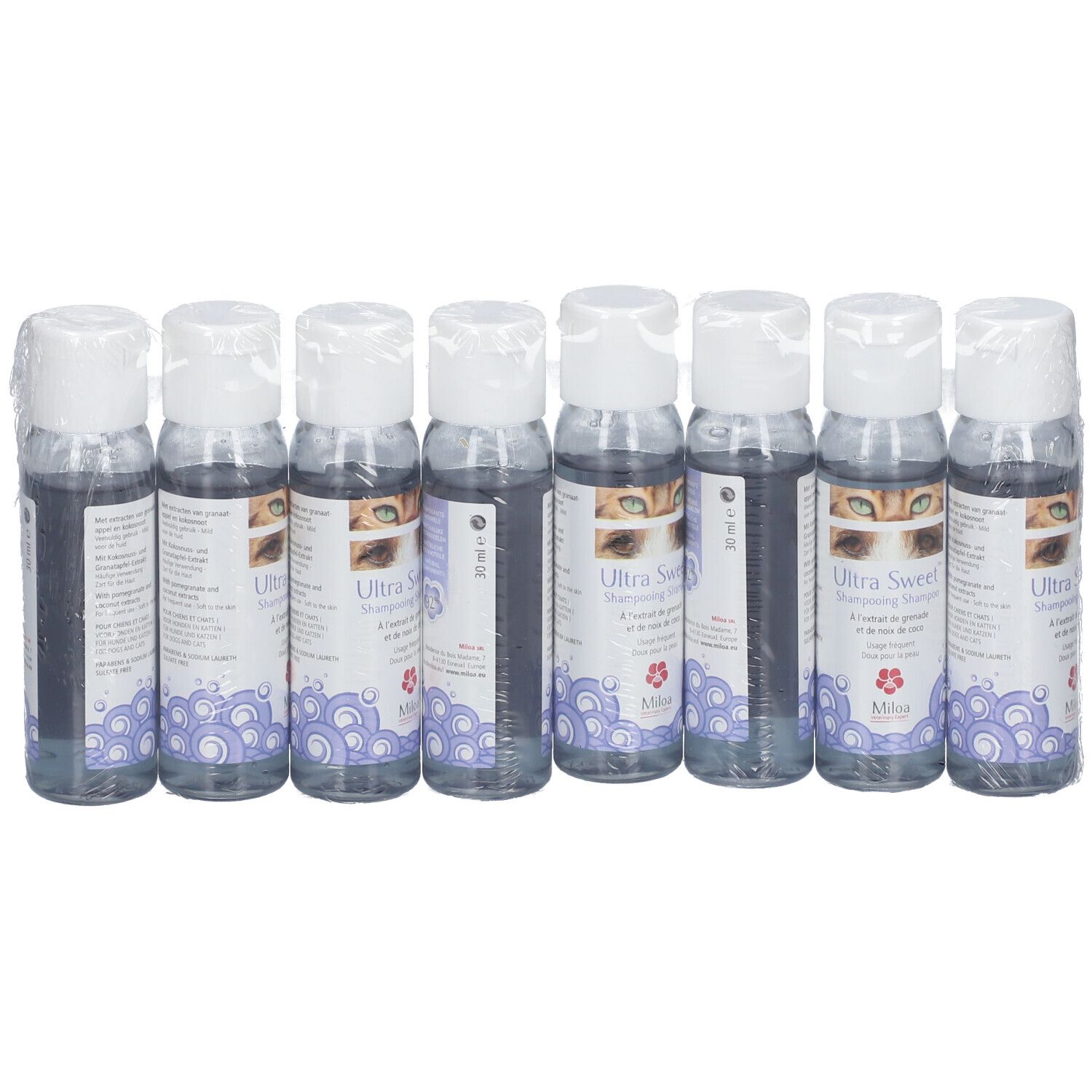 Acht Flaschen Miloa Ultra Sweet™ in Folie verpackt. Etiketten mit Produktnamen, Augenmotiv und floralem Muster.