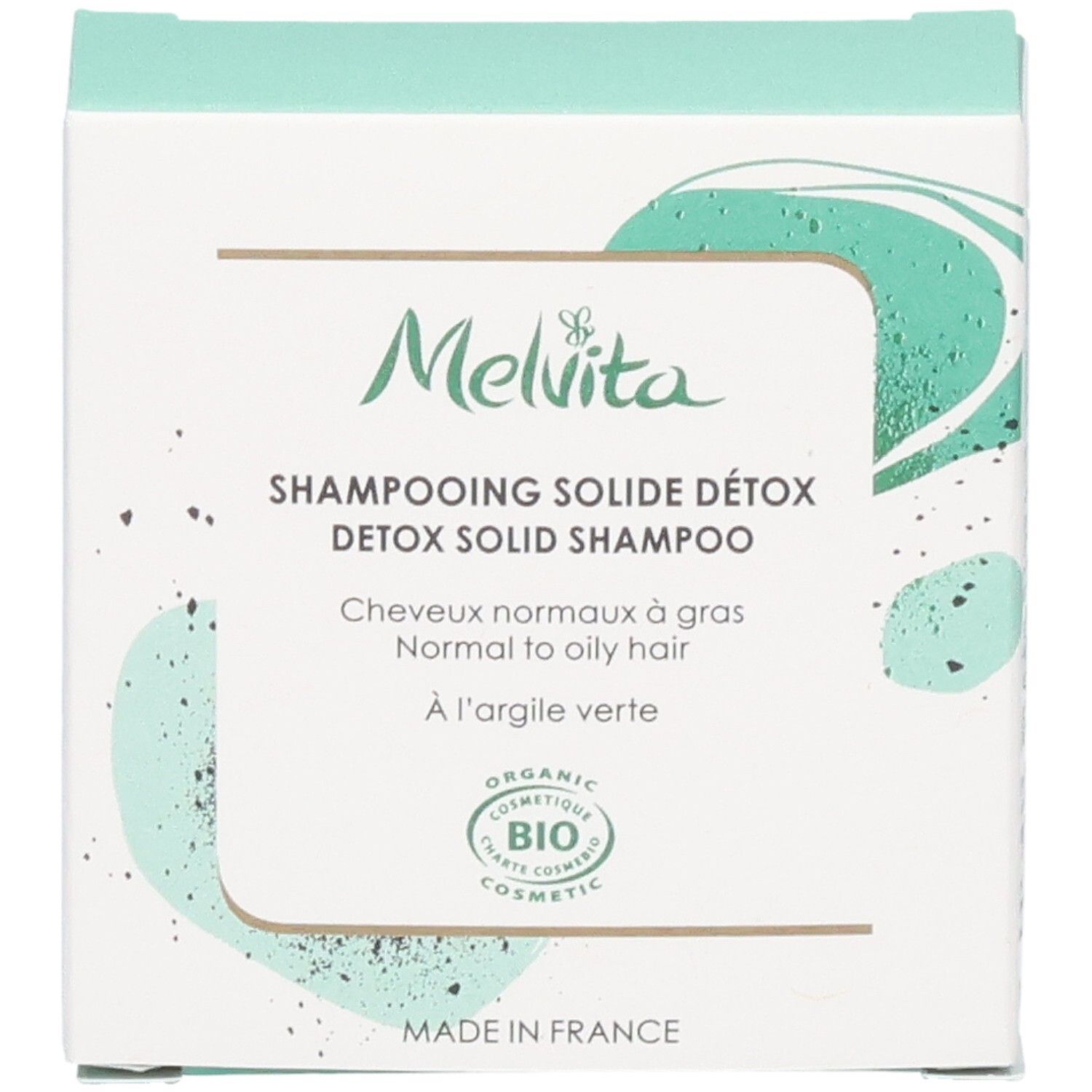 Boîte de shampoing solide détox Melvita avec label BIO et mention "Made in France".