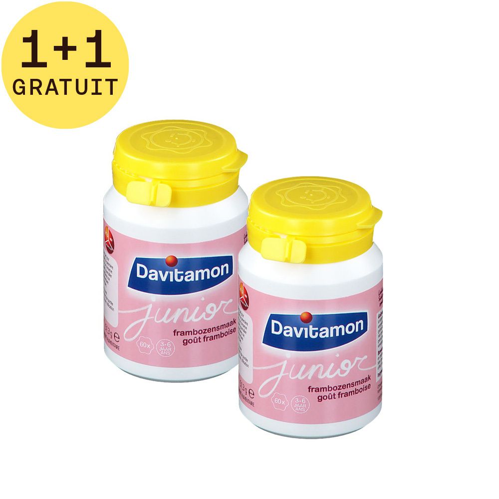 Deux flacons de Davitamon Junior. Flacons blancs avec couvercles jaunes. Inscription: goût framboise. 1+1 GRATUIT.