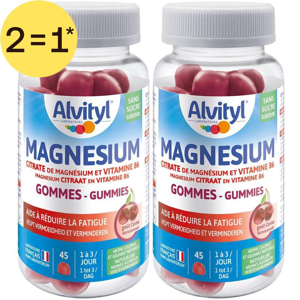 Deux flacons de gummies Alvityl Magnesium. Étiquettes bleues avec nom et informations du produit. Bonbons rouges visibles.