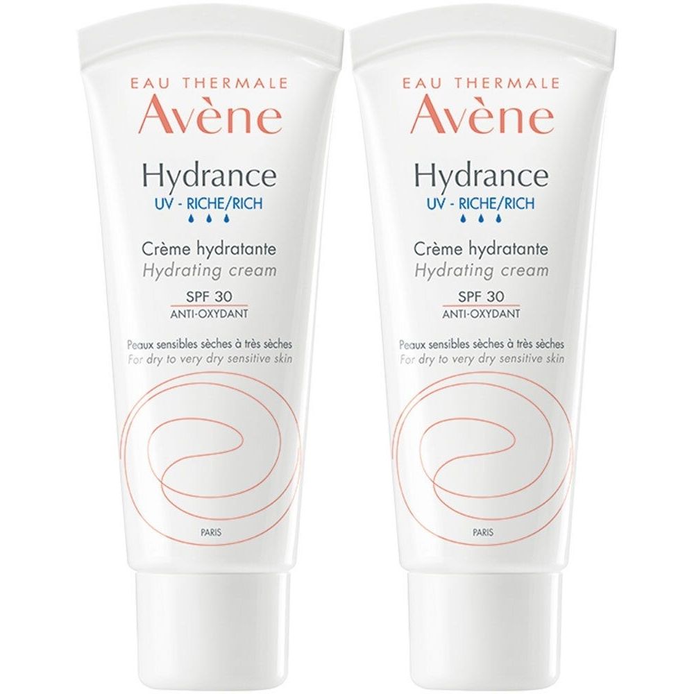 Deux tubes de crème blanche. Texte: Avène Hydrance, Crème hydratante, SPF 30, pour peaux sensibles sèches. Logo Avène en haut.