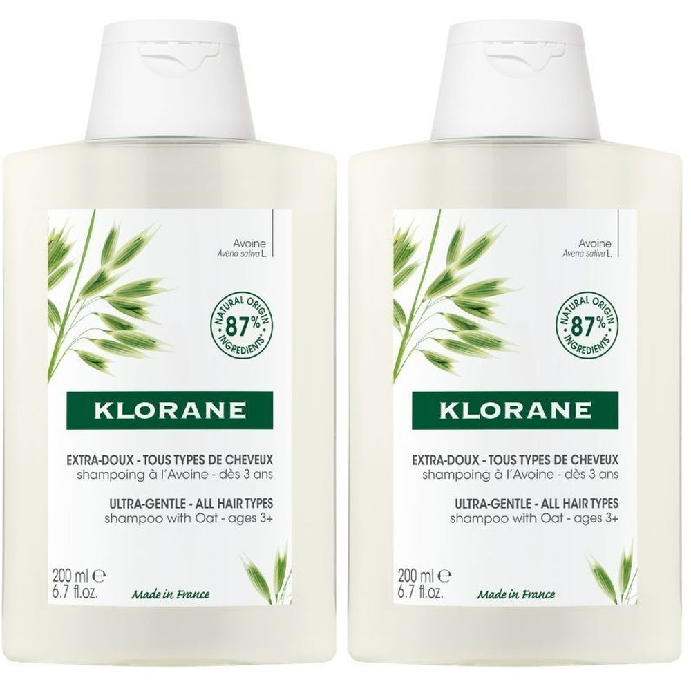Zwei Flaschen Shampoo mit weißem Deckel und Etikett. Aufschrift: Klorane, Extra-Doux, 87% natürliche Inhaltsstoffe.