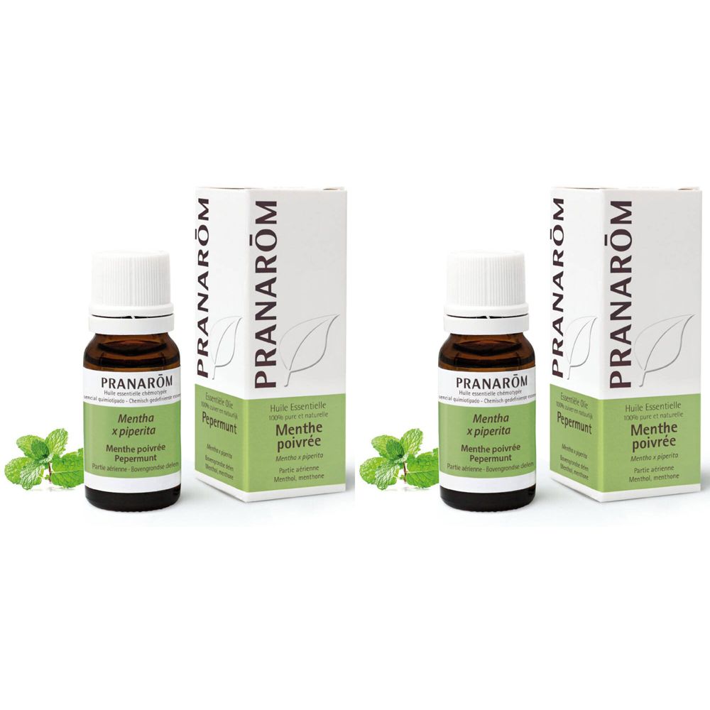 Zwei Flaschen und Verpackungen. Aufschrift: Pranarôm, Mentha x piperita, Huile Essentielle. Grüne Blätter.