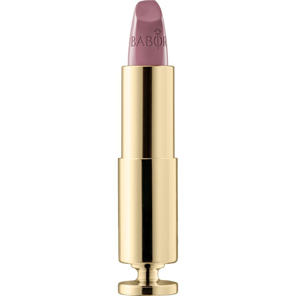 Goldfarbener Lippenstift mit rosa Spitze. Marke Babor ist sichtbar.