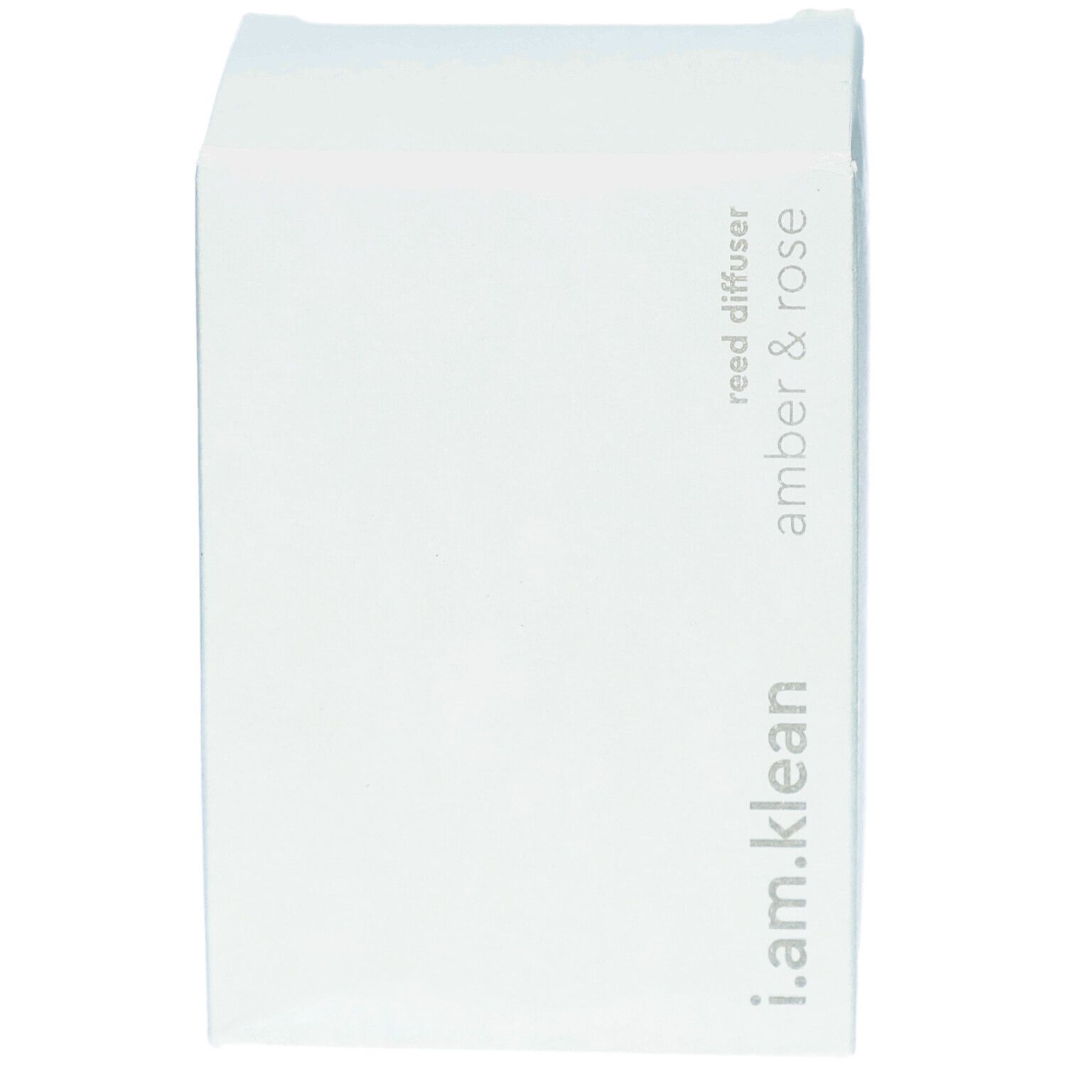 Boîte en carton blanche. Inscription : i.am.klean, reed diffuser, amber & rose.