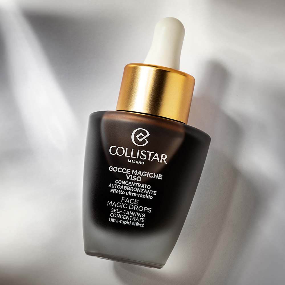 Flacon avec bouchon doré. Inscription : Collistar, Face Magic Drops.