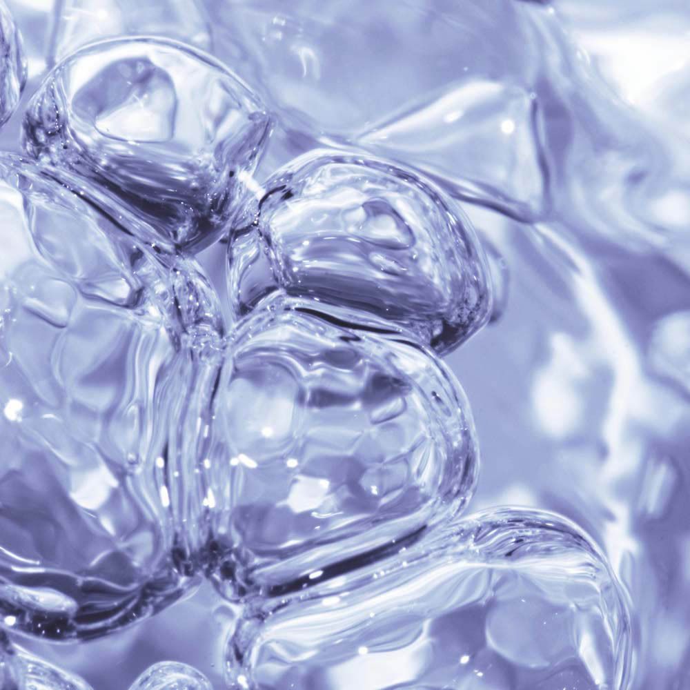 Gros plan de bulles dans un liquide.