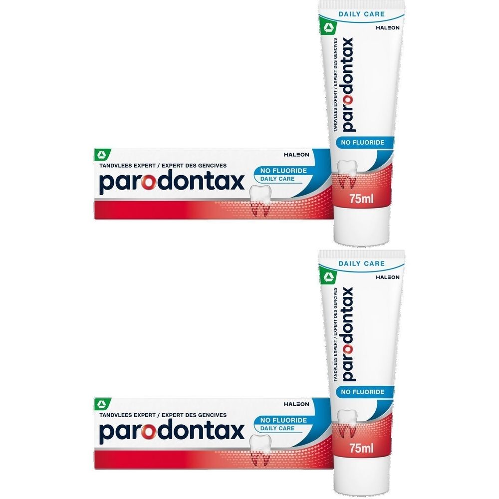 Deux tubes de dentifrice Parodontax sans fluor et deux boîtes. Tubes blancs avec texte rouge et bleu.