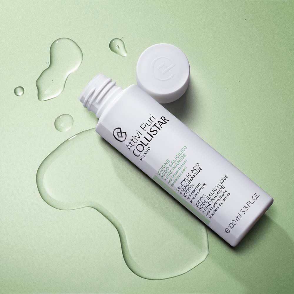 Flacon blanc avec bouchon et liquide. Inscription : Collistar, Lotion Acide Salicylique + Niacinamide. 100 ml.