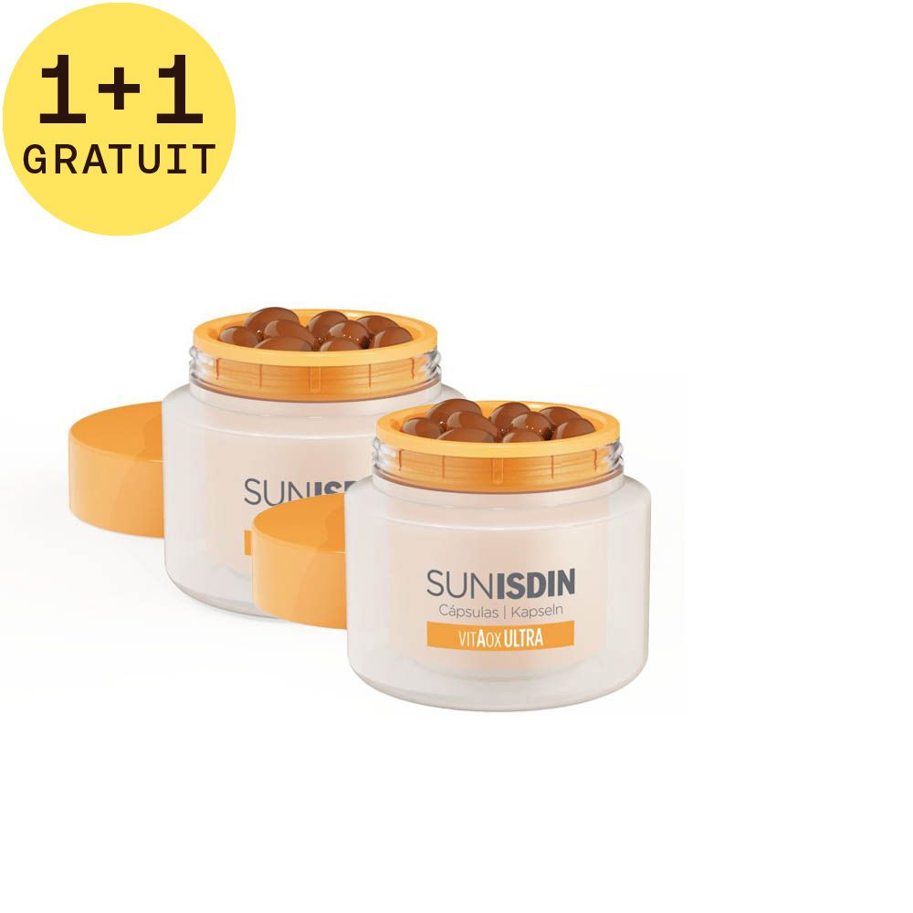 Deux pots ouverts avec gélules. Inscription SunISDIN Capsules. Label jaune 1+1 GRATUIT. Couvercles orange.