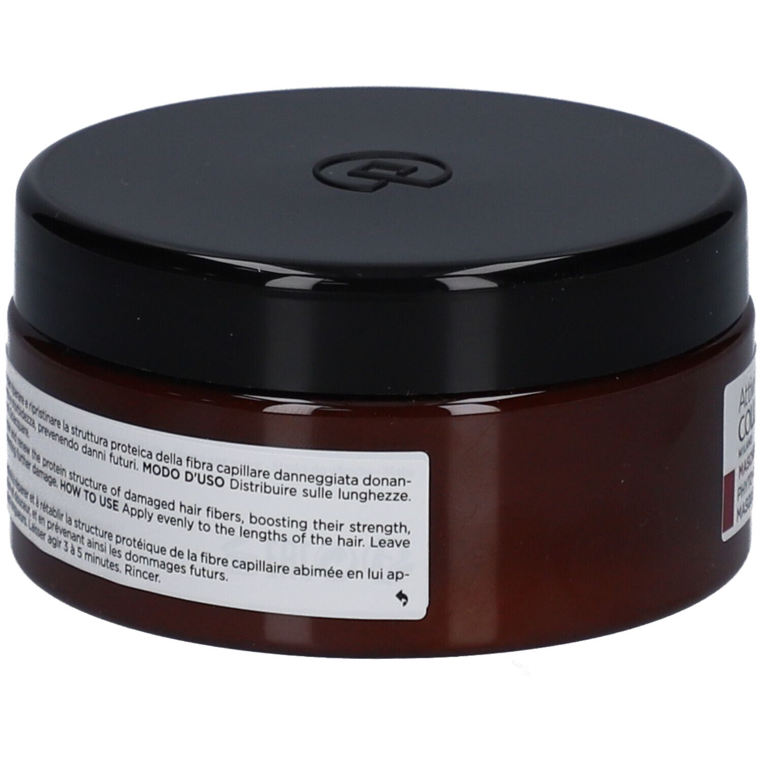 Pot brun avec couvercle noir. Inscription sur l'étiquette : Modo d'Uso, instructions d'utilisation.