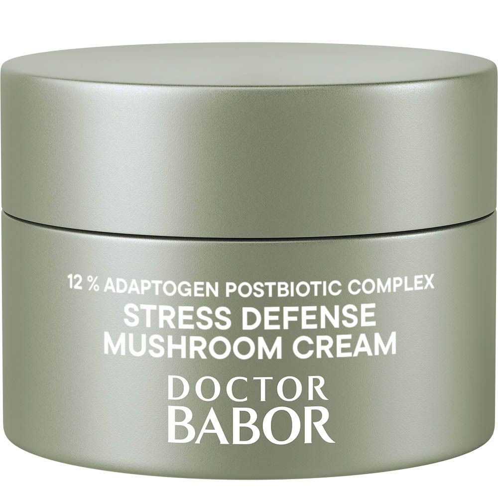 Graue Creme-Dose mit Text: 12% Adaptogen Postbiotic Complex, Stress Defense Mushroom Cream, DOCTOR BABOR.