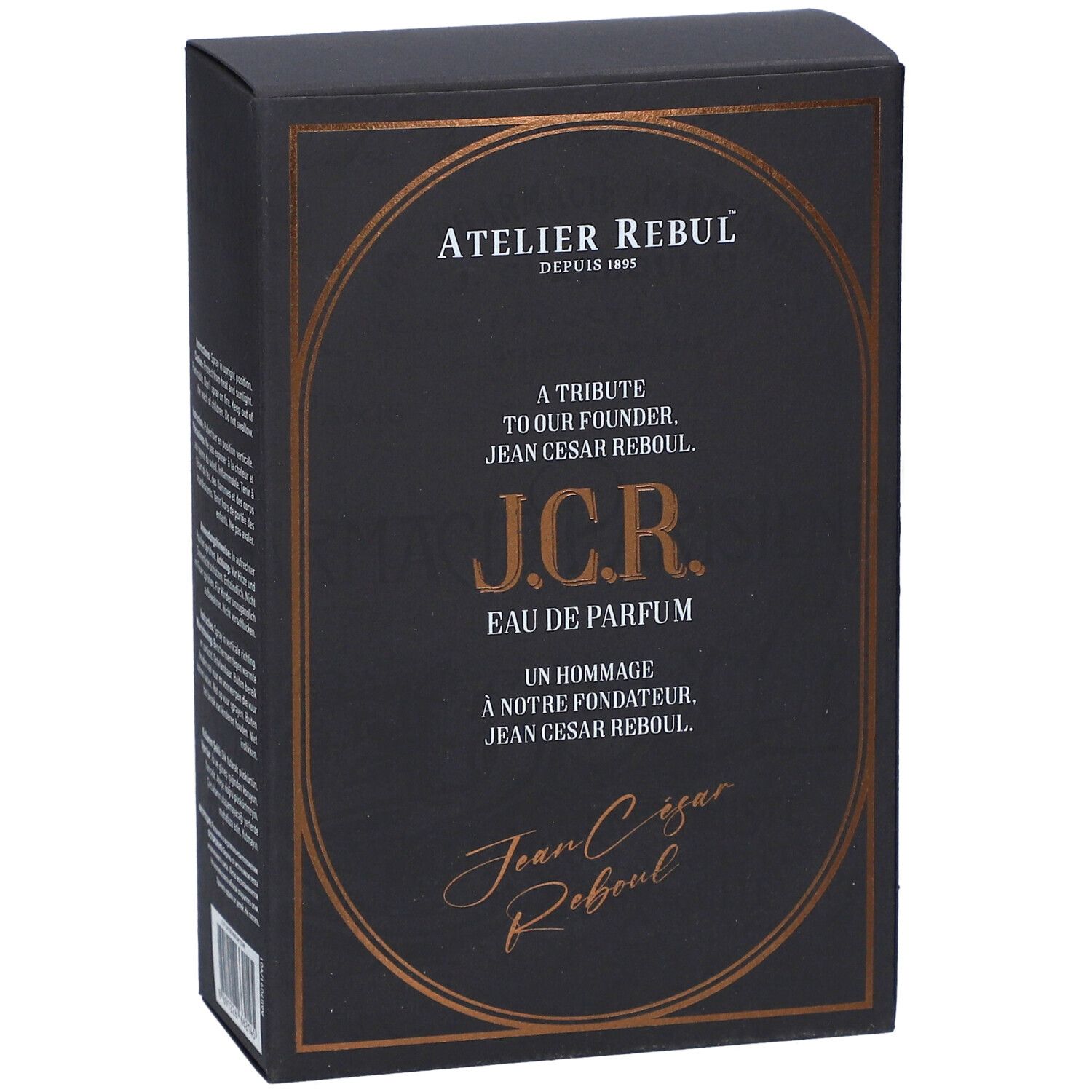 Schwarzer Karton mit goldfarbenem Rahmen. Text: Atelier Rebul, J.C.R. Eau de Parfum. Aufschrift: A Tribute to our Founder Jean Cesar Rebul.