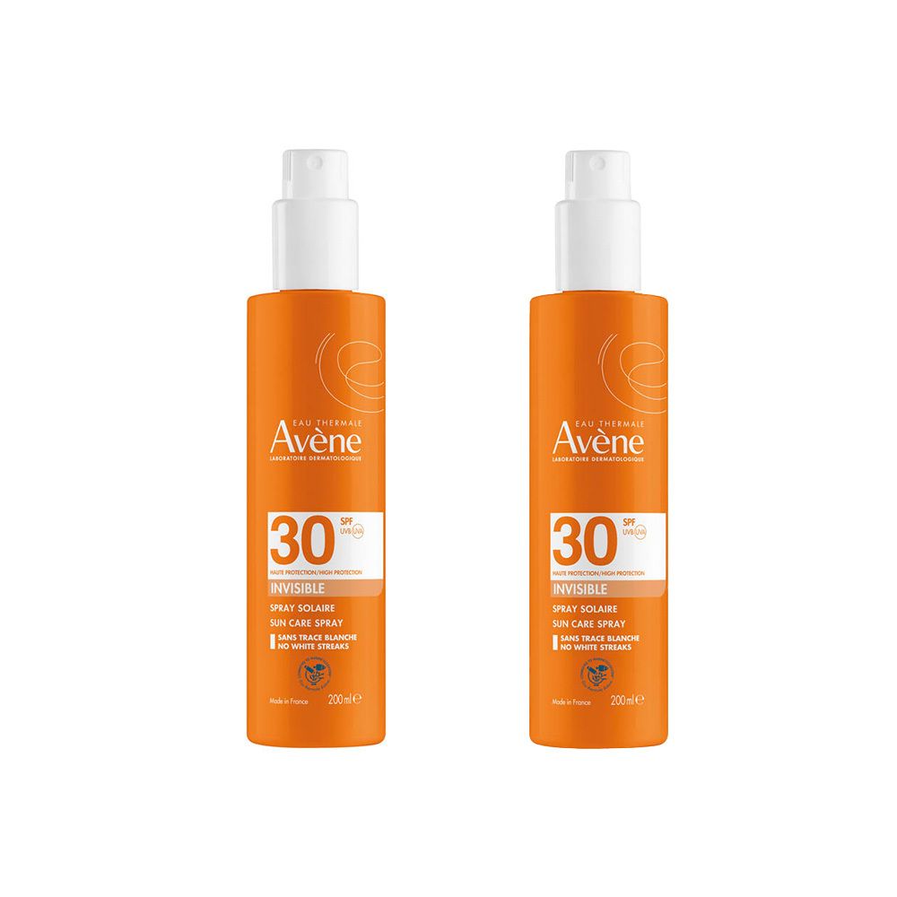 Deux sprays orange avec vaporisateur blanc. Inscription: Avène, SPF 30, Invisible Spray solaire. Pour peaux sensibles.