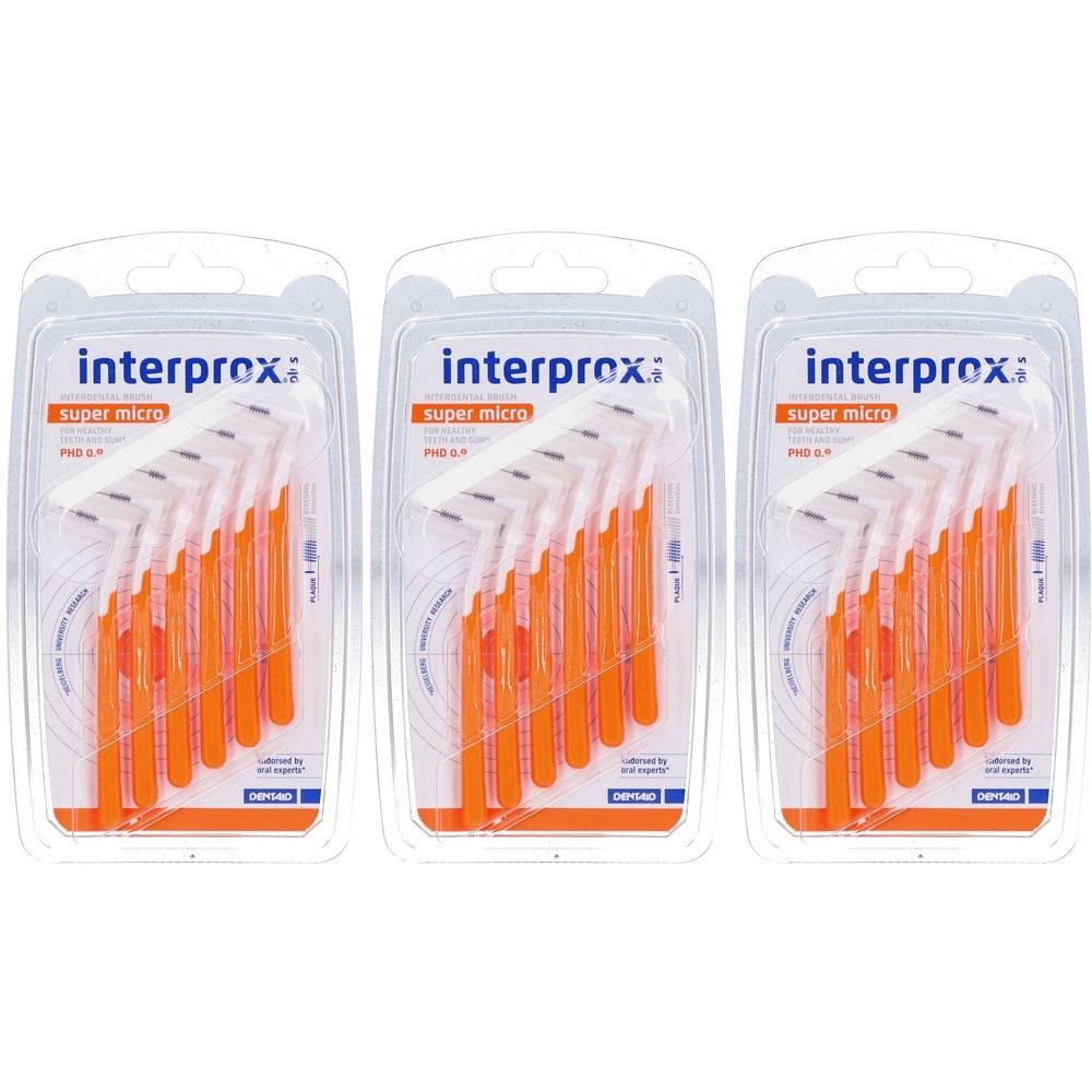 Trois blisters de brossettes interdentaires orange. Chaque paquet contient plusieurs brosses avec une tête de poils blancs.