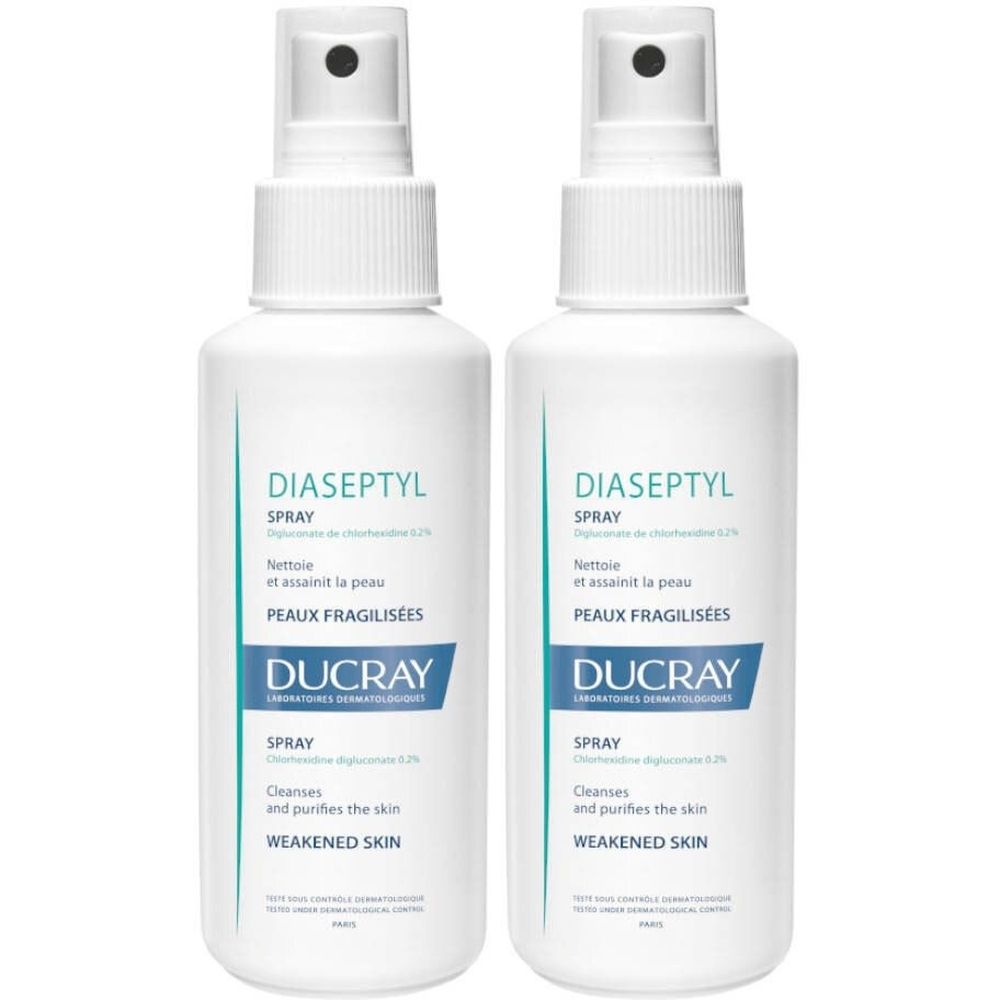 Zwei weiße Sprühflaschen mit blauer Beschriftung. Aufschrift: Diaseptyl Spray, Ducray.