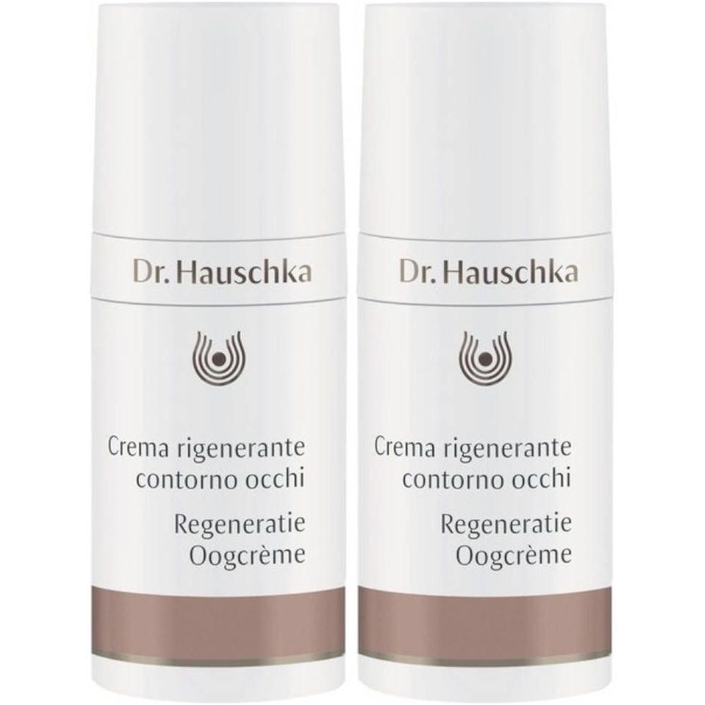 Deux flacons blancs avec bande marron. Inscription : Dr. Hauschka, Creme regenerante contorno occhi, Regeneration Oogcrème.