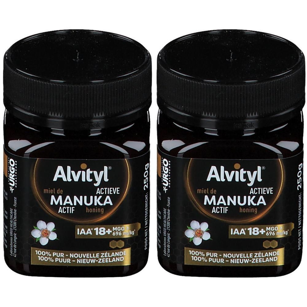 Zwei Gläser Alvityl Manuka-Honig ACTIF IAA 18+. Schwarze Gläser mit schwarzem Deckel. Etikett mit Produktinformationen.