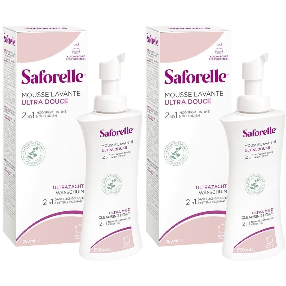 Deux flacons et emballages Saforelle mousse lavante. Emballage rose et blanc, flacon avec pompe. Texte: Ultra doux.