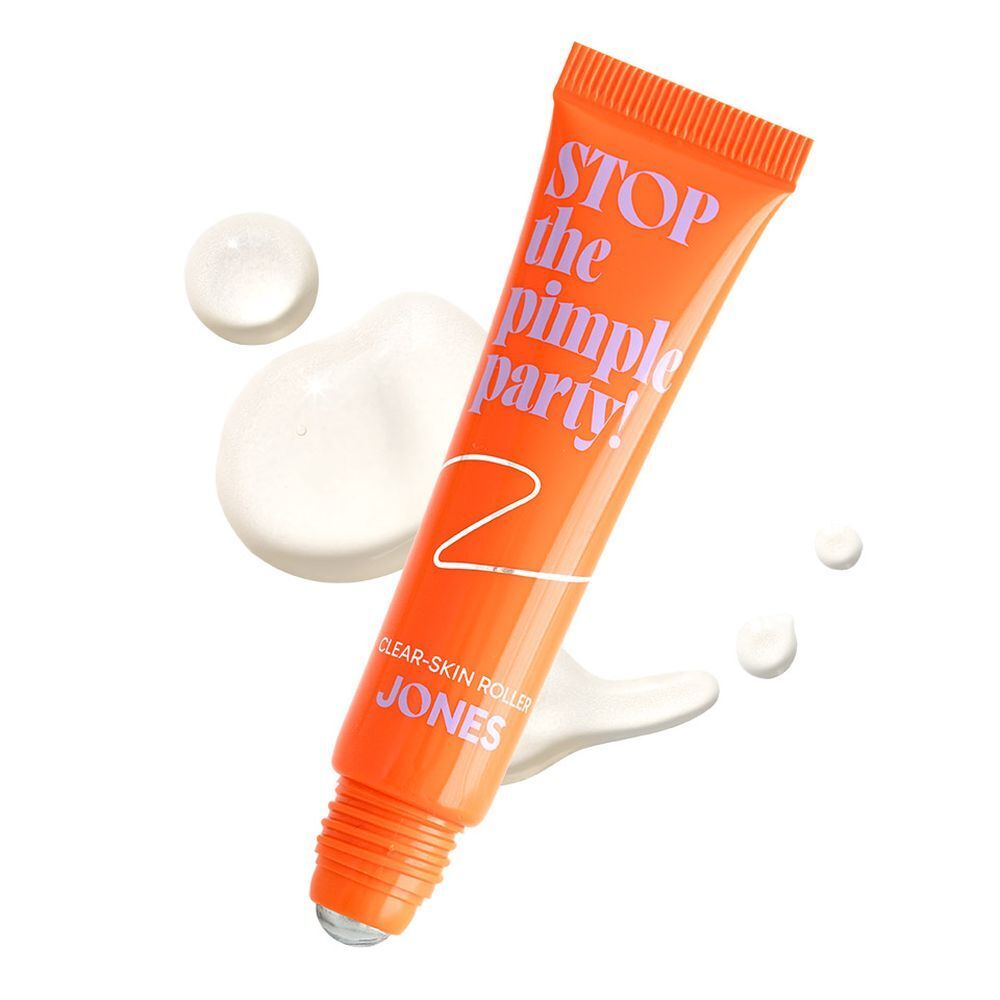 Tube orange avec texte. Texte : Stop the Pimple Party! Clear-Skin Roller. Marque : JONES. Produit et liquide.
