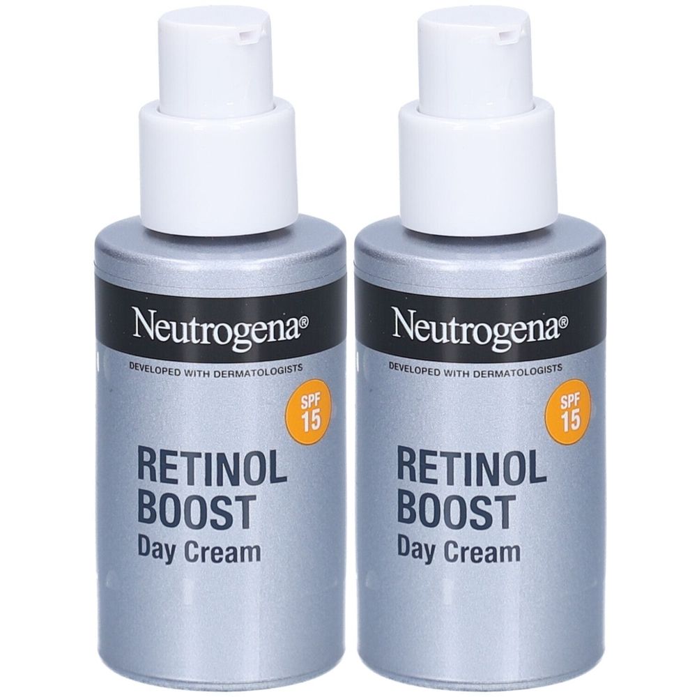 Zwei Flaschen Neutrogena Retinol Boost Tagescreme LSF 15. Graue Flaschen mit weißem Pumpkopf. Aufschrift: Retinol Boost Day Cream.