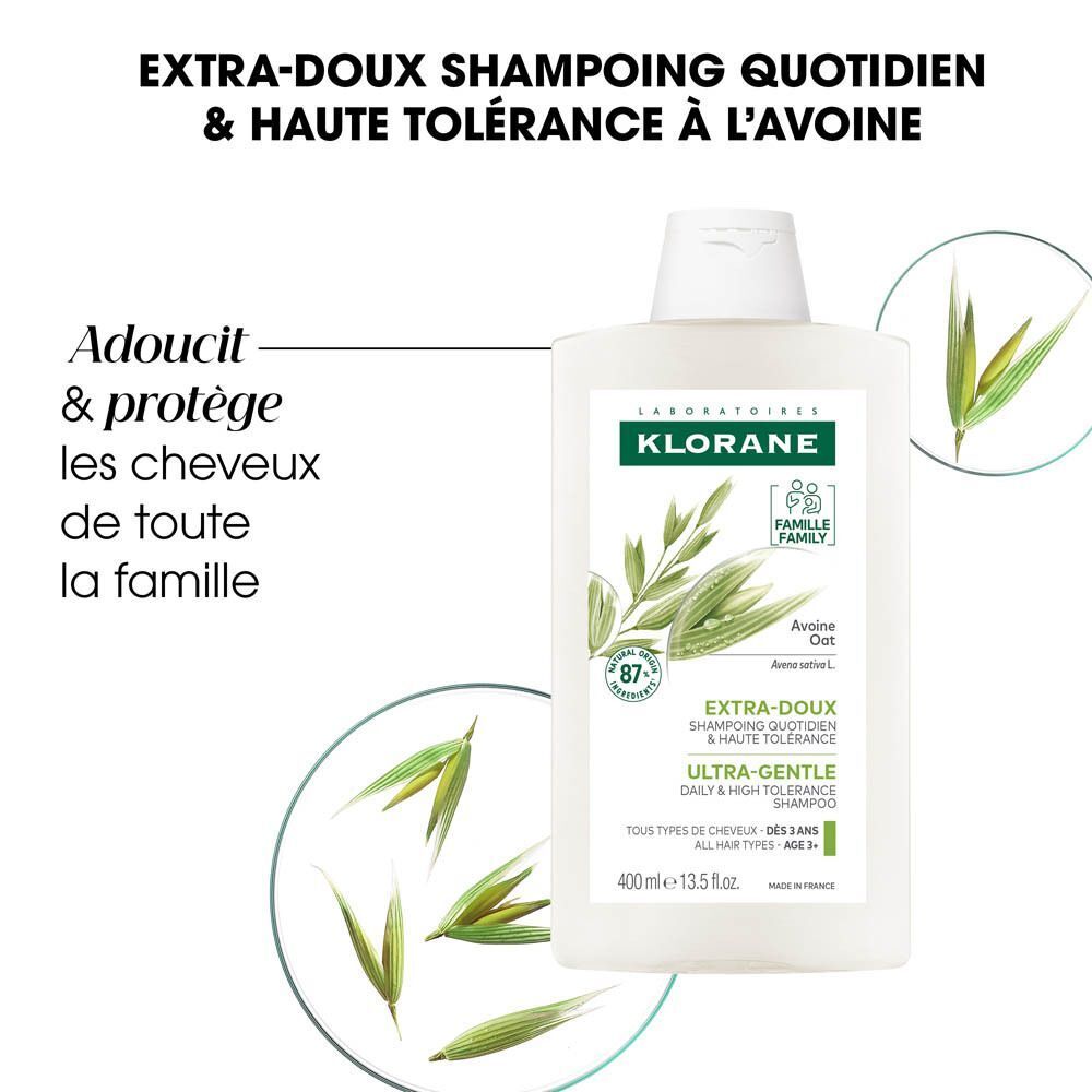 Flacon de shampooing. Blanc, étiquette verte. Marque : KLORANE. Texte : Extra-Doux, Ultra-Gentle, Lait d'Avoine. 400 ml.